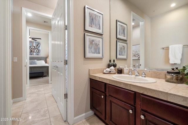 bathroom with tile patterned floors, ensuite bathroom, visible vents, baseboards, and vanity