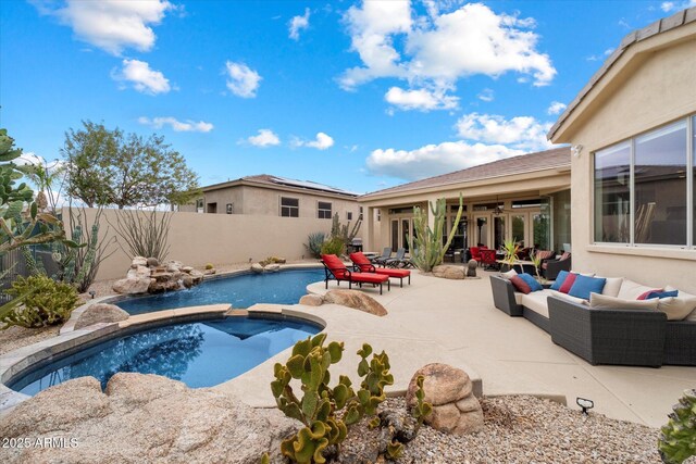 view of swimming pool featuring a fenced in pool, french doors, a fenced backyard, a patio, and an outdoor living space