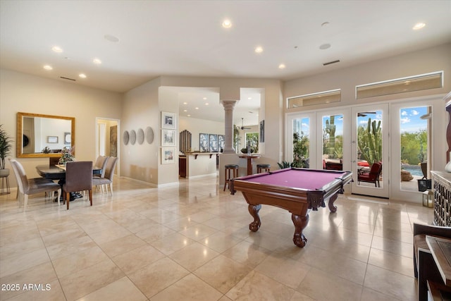 rec room with recessed lighting, a healthy amount of sunlight, ornate columns, and french doors