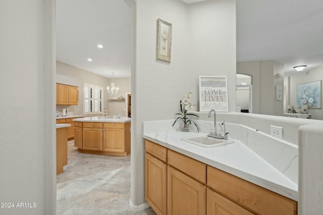 755 E Orchid Ln, Gilbert, AZ 85296 - bathroom featuring sink and a notable chandelier
