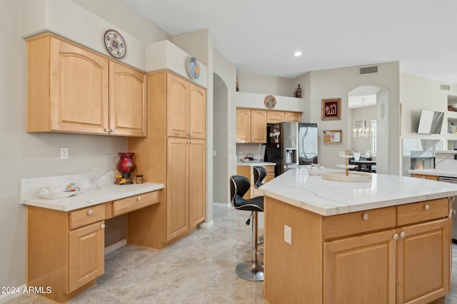755 E Orchid Ln, Gilbert, AZ 85296 - kitchen featuring an inviting chandelier, black fridge, dishwashing machine, light brown cabinetry, and a kitchen island