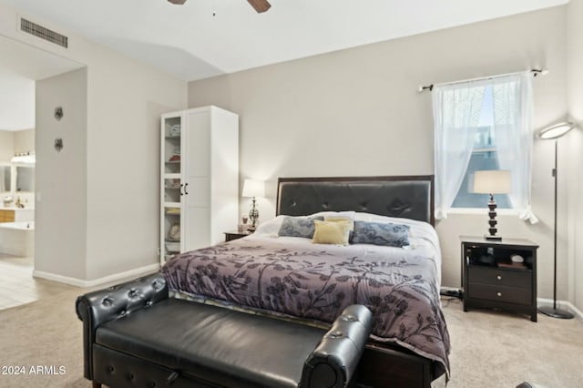 755 E Orchid Ln, Gilbert, AZ 85296 - bedroom with ensuite bathroom, ceiling fan, and light colored carpet