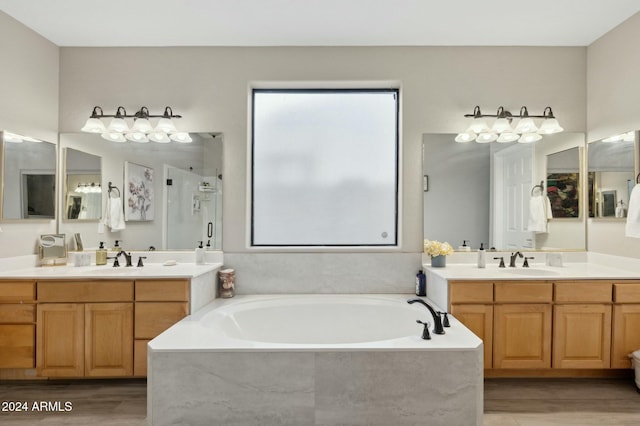 755 E Orchid Ln, Gilbert, AZ 85296 - bathroom with hardwood / wood-style floors, vanity, and shower with separate bathtub