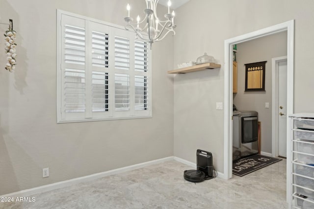 755 E Orchid Ln, Gilbert, AZ 85296 - interior space with an inviting chandelier, cabinets, and washing machine and clothes dryer