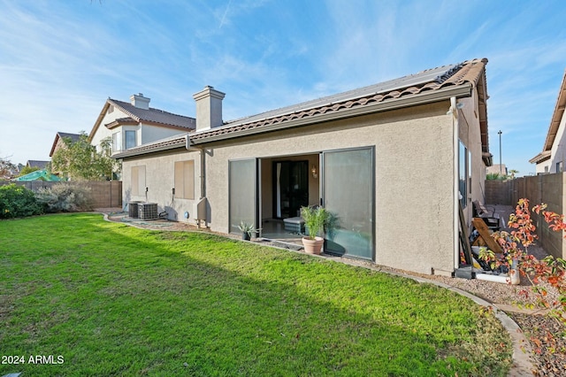 755 E Orchid Ln, Gilbert, AZ 85296 - back of house with a yard and central air condition unit