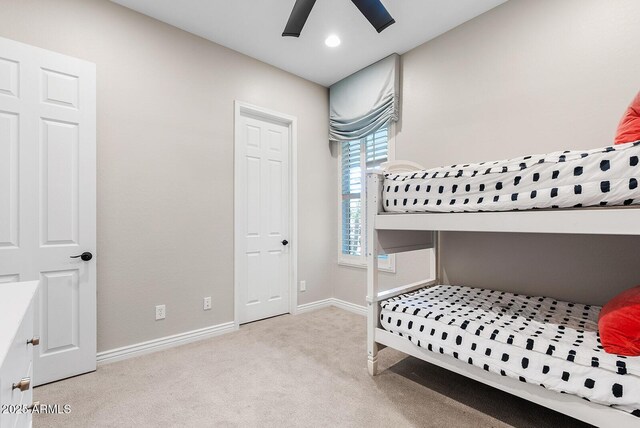 bedroom with baseboards, carpet, and ceiling fan