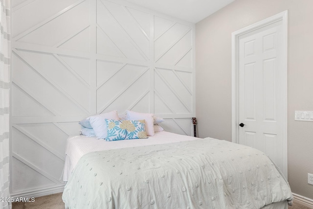 bedroom with carpet floors and baseboards