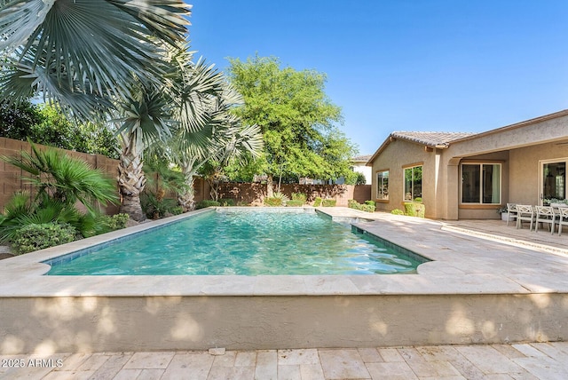 view of pool with a fenced in pool, a fenced backyard, and a patio area