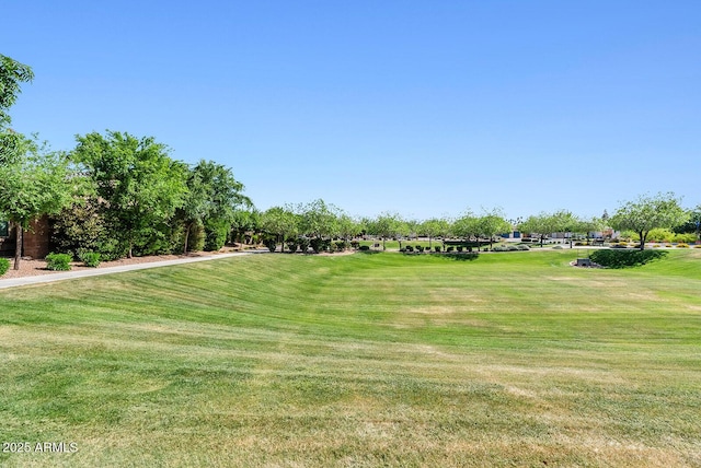 surrounding community featuring a lawn