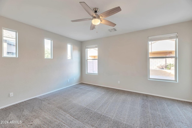 spare room with ceiling fan and carpet floors