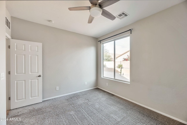 carpeted empty room with ceiling fan