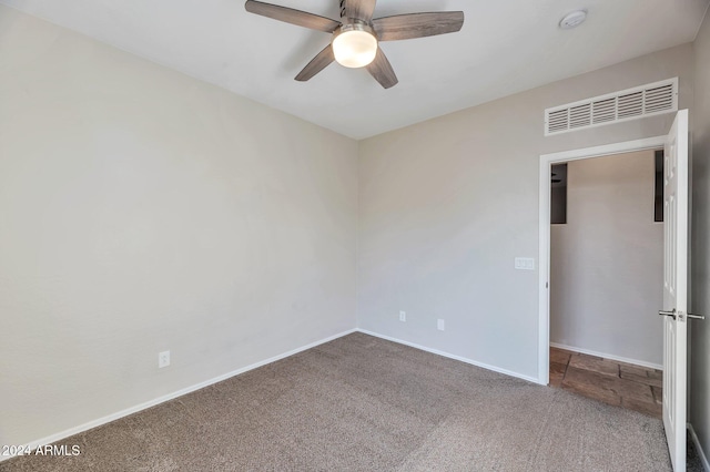 empty room with carpet and ceiling fan