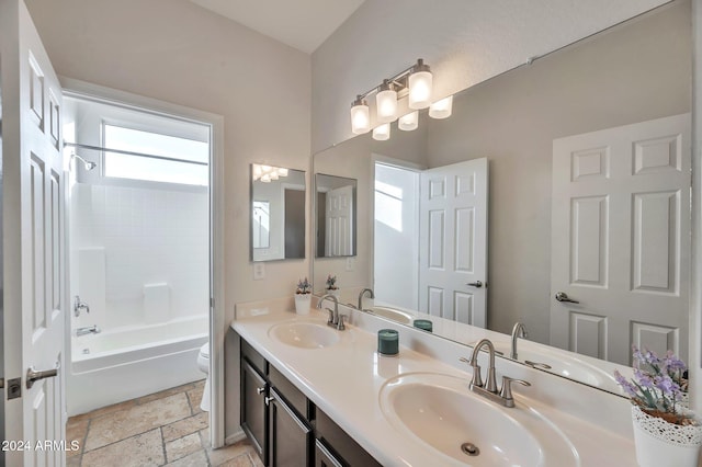 full bathroom featuring vanity, shower / bathtub combination, and toilet