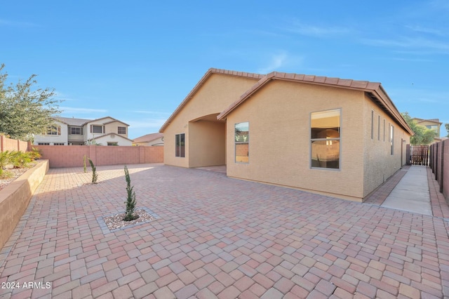 rear view of property with a patio