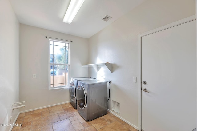 washroom featuring washing machine and dryer