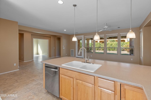 kitchen featuring sink, decorative light fixtures, stainless steel dishwasher, and light brown cabinets