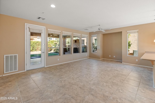 unfurnished room with light tile patterned floors and ceiling fan