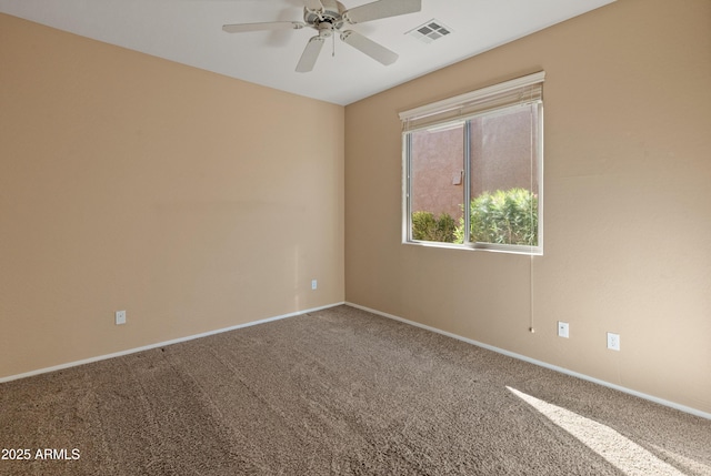 spare room with ceiling fan and carpet floors