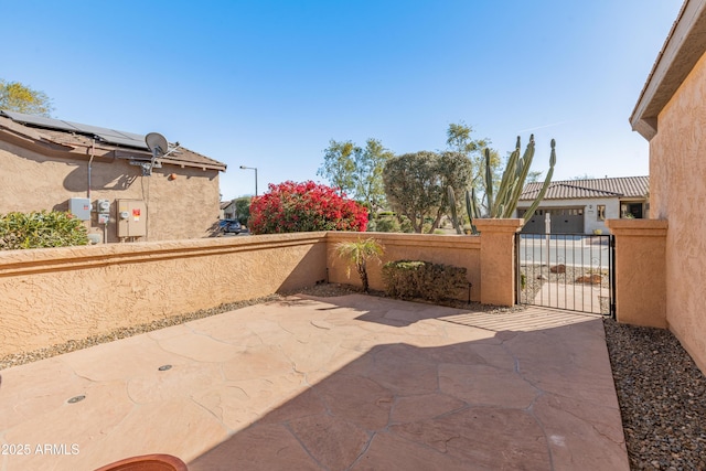 view of patio / terrace featuring a garage