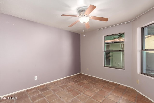 unfurnished room with ceiling fan