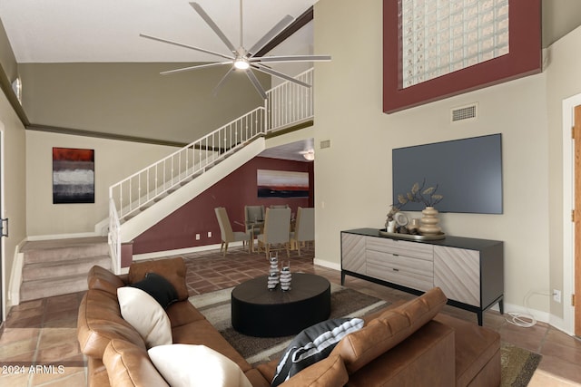 living room featuring ceiling fan, tile patterned flooring, and high vaulted ceiling