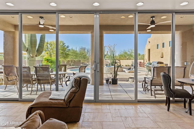 entryway featuring stone tile flooring, recessed lighting, and ceiling fan