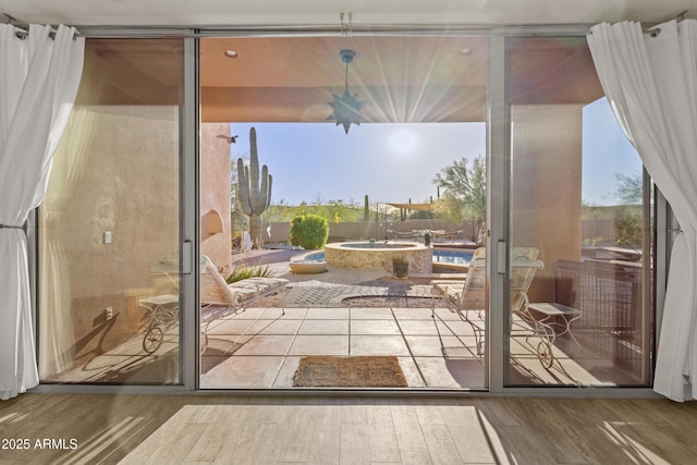 doorway to outside with wood finished floors