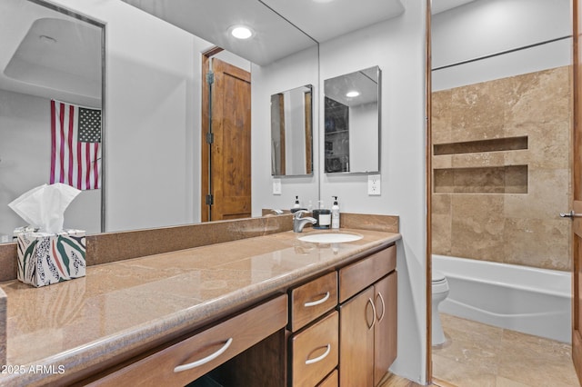 bathroom featuring recessed lighting, vanity, toilet, and bathing tub / shower combination