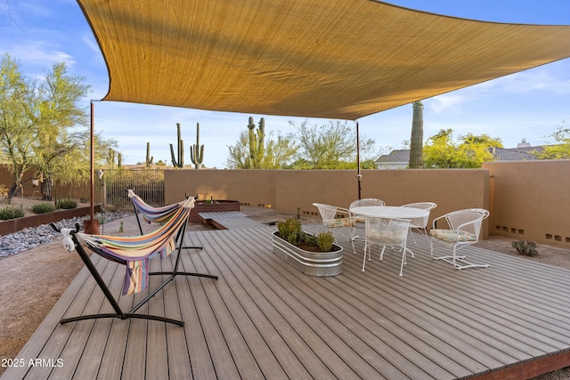 deck featuring fence and outdoor dining area
