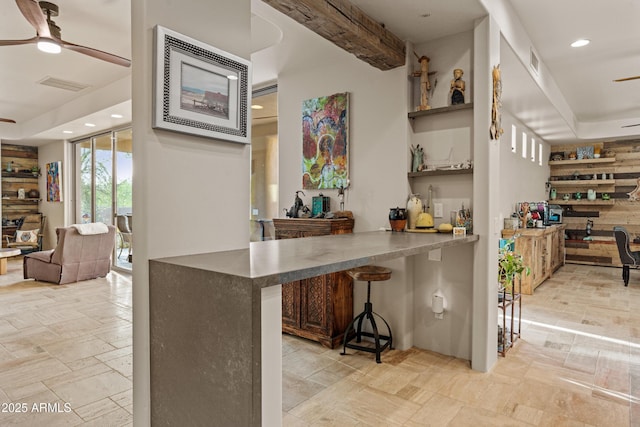 bar featuring ceiling fan, recessed lighting, stone tile flooring, and visible vents