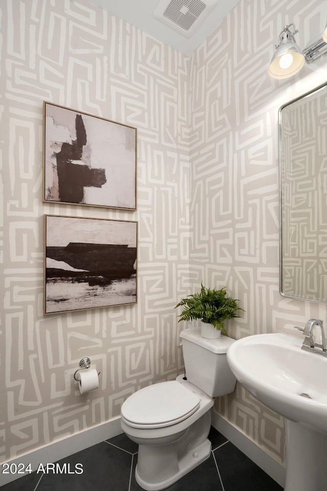 bathroom featuring tile patterned floors and toilet