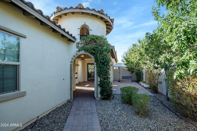 property entrance with a patio area