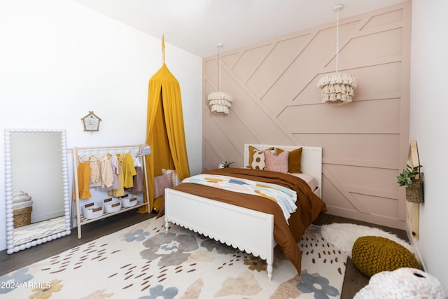 bedroom with dark wood-type flooring