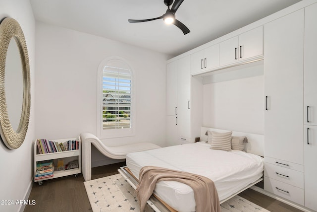 bedroom featuring dark hardwood / wood-style flooring and ceiling fan