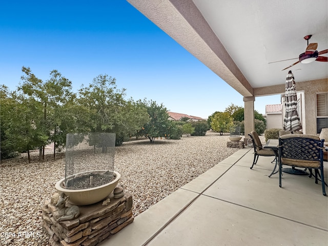 view of patio featuring ceiling fan