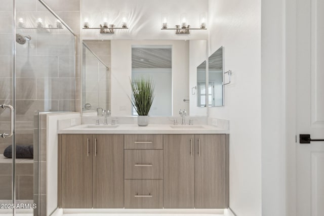 bathroom featuring double vanity, a sink, and a stall shower