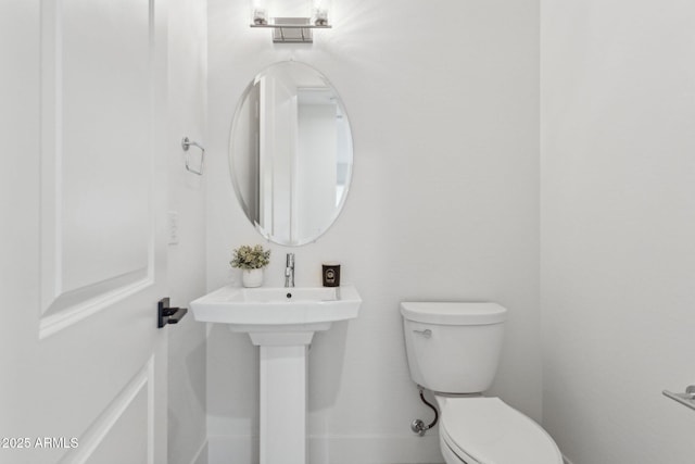 bathroom featuring toilet