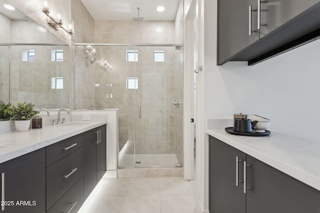 bathroom featuring vanity, tile patterned floors, recessed lighting, a shower stall, and a healthy amount of sunlight