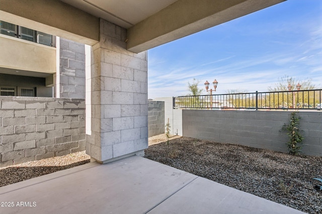 exterior space with a patio and fence