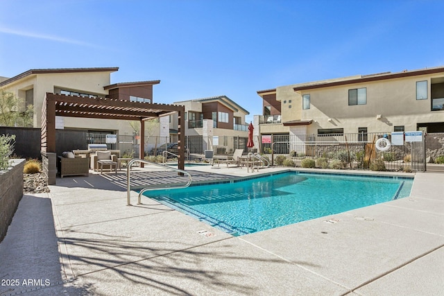 pool featuring a patio area, fence, a pergola, and a residential view