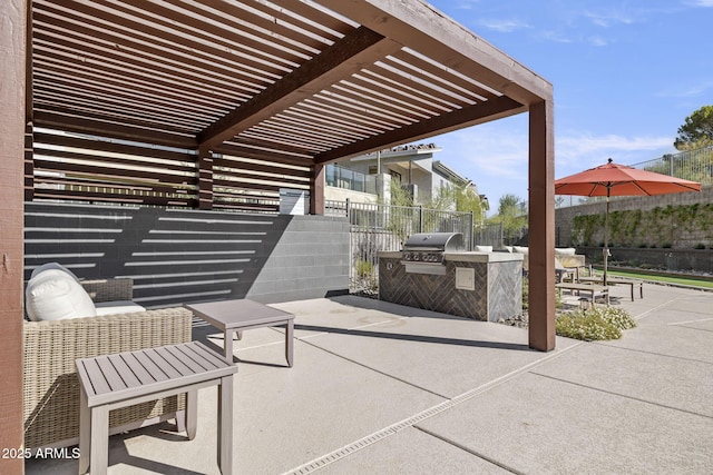 view of patio with area for grilling, a pergola, and fence