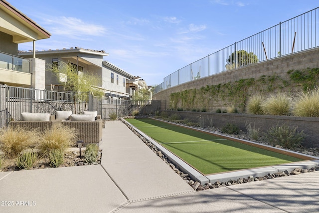 view of home's community with fence and a residential view