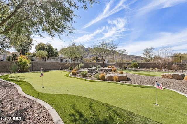 view of community with a fenced backyard