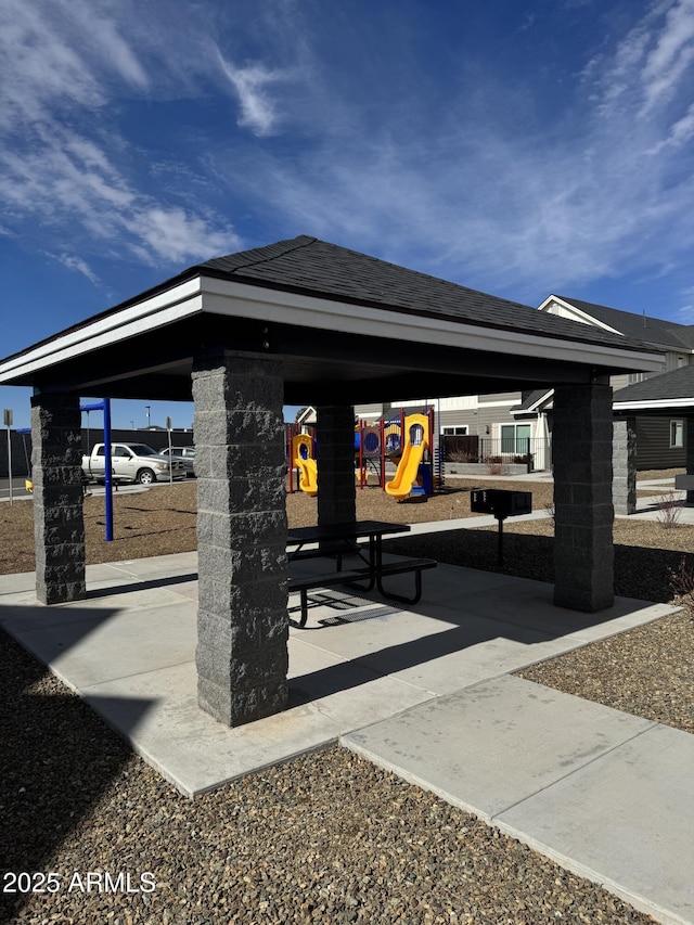 view of home's community featuring playground community