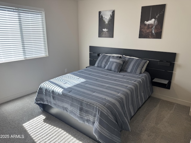 carpeted bedroom with baseboards