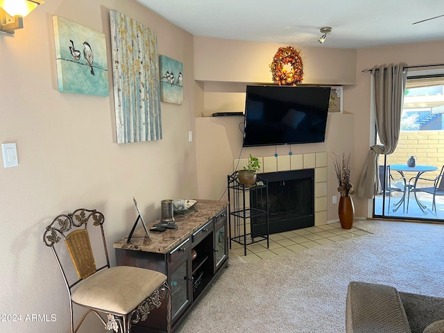 living room with a fireplace and light carpet