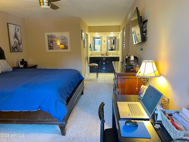 bedroom featuring ceiling fan and ensuite bathroom