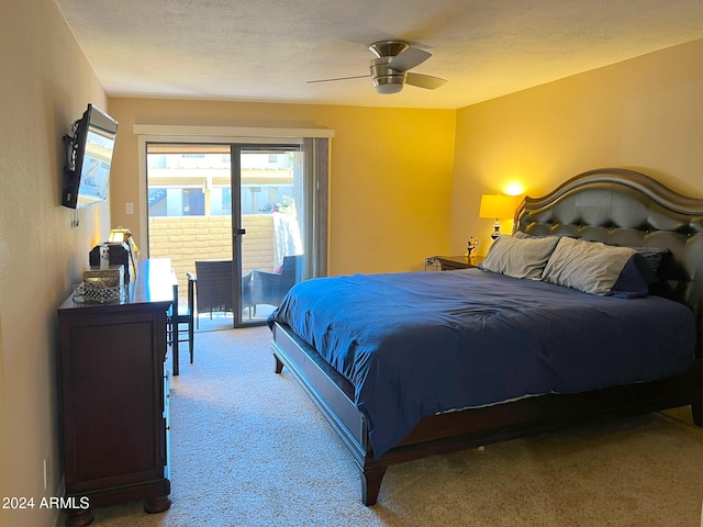 carpeted bedroom featuring a textured ceiling, access to outside, and ceiling fan