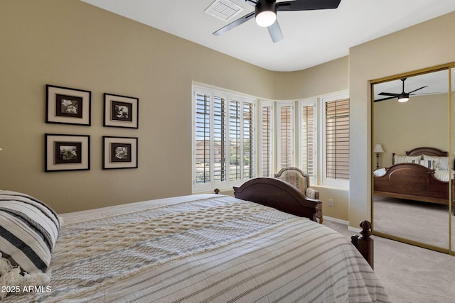bedroom featuring carpet flooring, a ceiling fan, baseboards, and visible vents