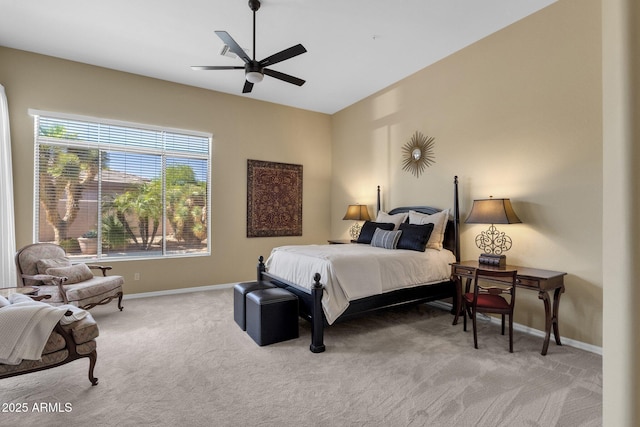 bedroom with baseboards, ceiling fan, and light colored carpet